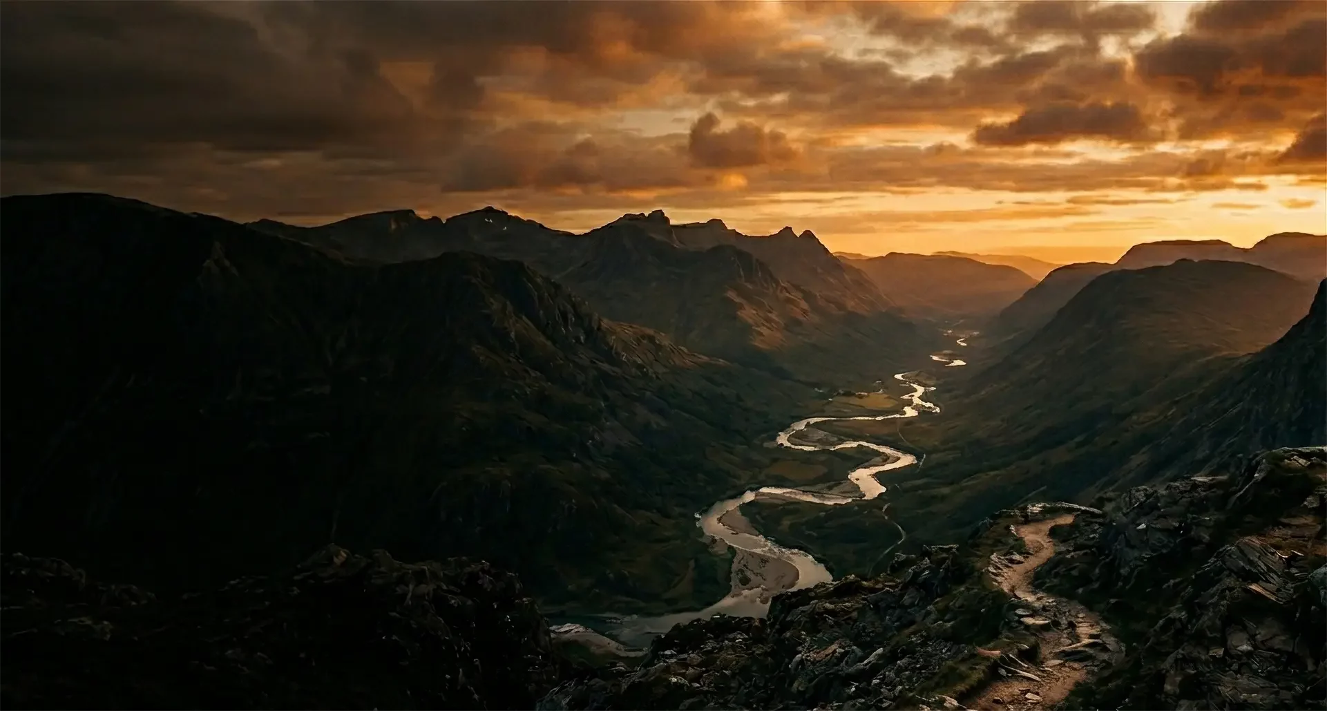 Mountain range with meandering river and hiking trail